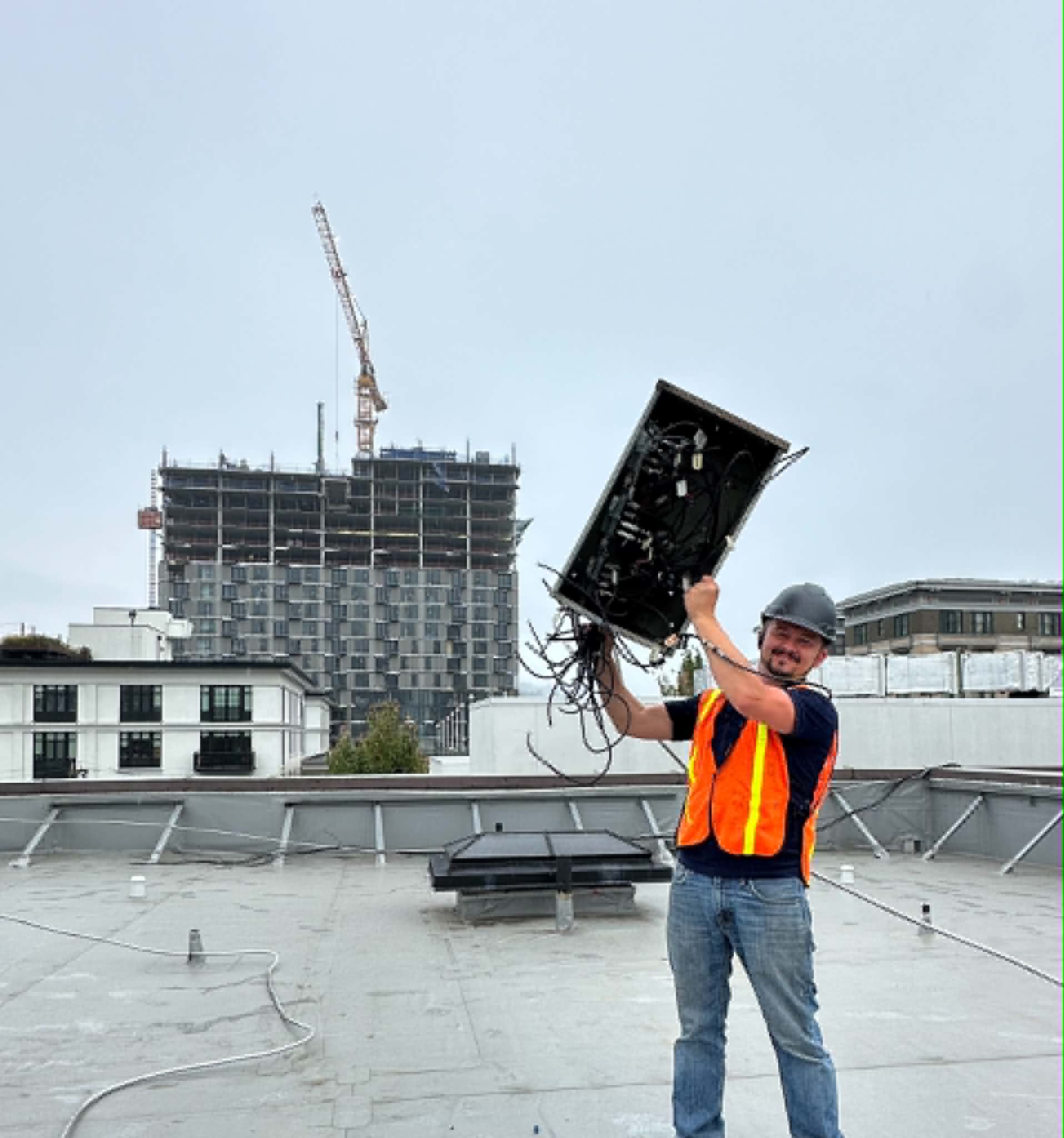 NW Fiber Co performing rooftop telecom work on a commercial building in the Portland metro